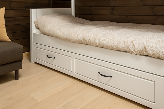 Minimalist bedroom with white wooden bed featuring under-bed storage drawers, styled with cozy neutral bedding – NeatNest