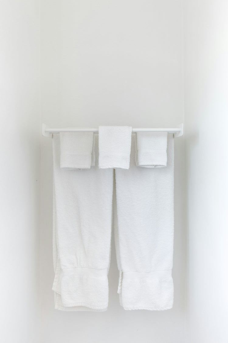 Wall-mounted towel hooks and bars
